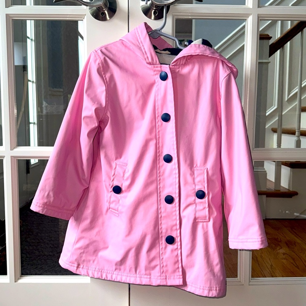 Pink and navy waterproof raincoat. PVC free, fully lined, machine washable.